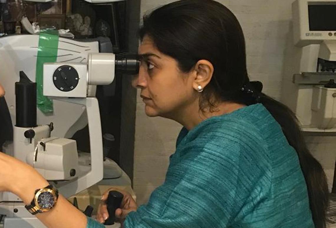 Dr. Dipti Shah examining a patient at Sadhana Eye Care